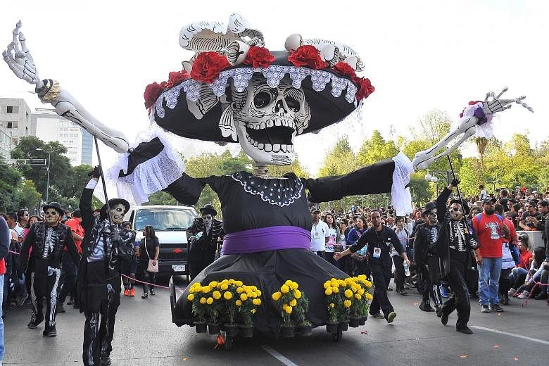 Floats with a death theme during Mexico City's Day of the Dead procession last Saturday inspired by the 2015 Bond movie Spectre.