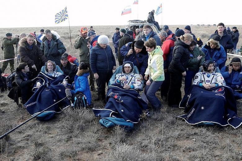 The Russian Soyuz MS space capsule after landing with the three ISS crew members who had spent 115 days aboard the International Space Station. The ISS crew members (from left) Kathleen Rubins of the US, Anatoly Ivanishin of Russia and Takuya Onishi 