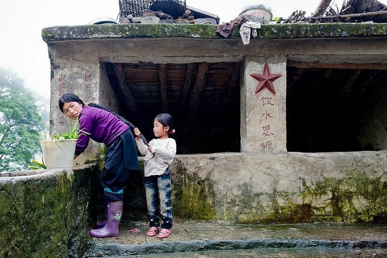 Above: A woman in Yuanyang county, Honghe prefecture, in Yunnan, fetches water with her daughter. Left: With the completion of the water project in August last year, some 1,850 residents in Huangtian village, in south-west Guizhou province, just need