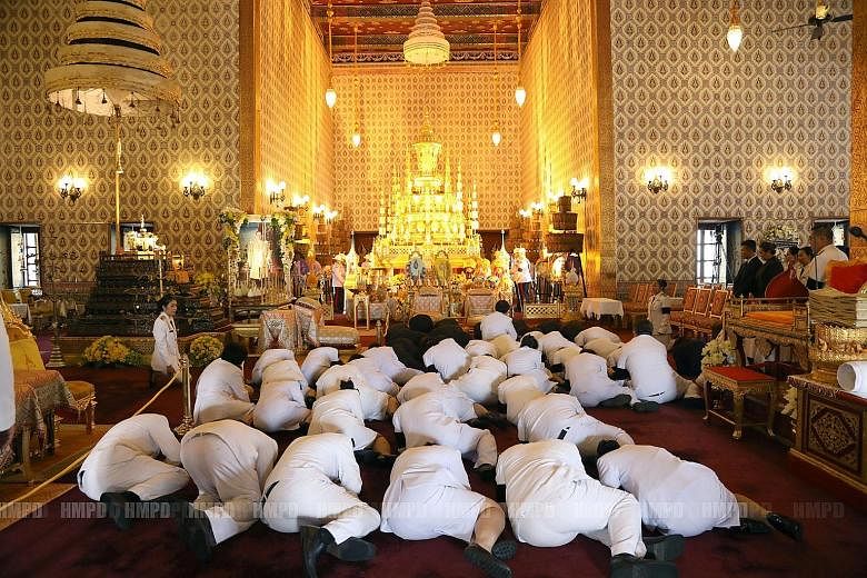 Mourners paying their respects to Thailand's late King Bhumibol Adulyadej in the Grand Palace in Bangkok on Sunday. Crown Prince Maha Vajiralongkorn will return from Germany this month, said a senior military source.