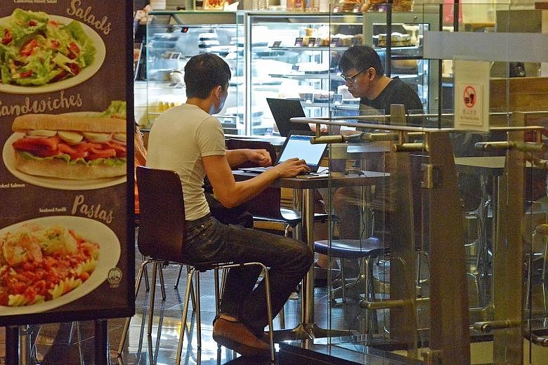 Coffee Bean and Tea Leaf customers at the HDB Hub. The IMDA said about two million unique users a month log in to Wireless@SG services.