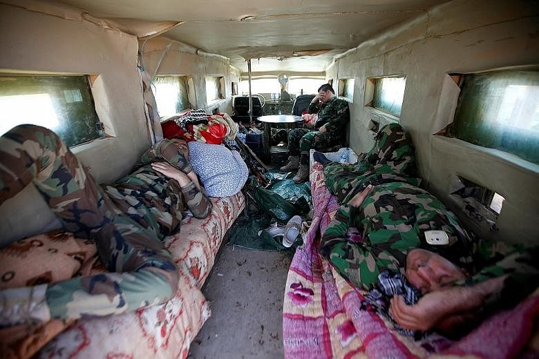 Peshmerga fighters resting on Sunday in a military vehicle on the outskirts of Bashiqa, east of Mosul, amid an ongoing operation against ISIS militants in Iraq. The capture of Mosul would mark the ISIS militants' effective defeat in the Iraqi half of