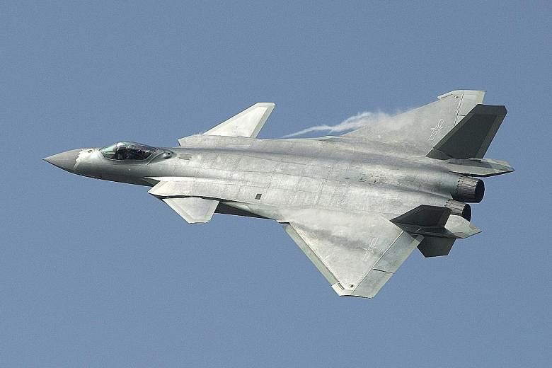 China's new J-20 stealth fighter at the Zhuhai air show, in Guangdong province, yesterday.