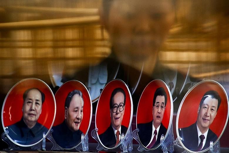 Souvenir plates with portraits of Chinese leaders past and present (from left) Mao Zedong, Deng Xiaoping, Jiang Zemin, Hu Jintao and Xi Jinping. Mr Xi has officially been designated as the party's "core" leader, a status that is expected to give him 
