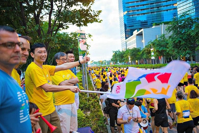 Runners being flagged off at Run For Hope 2016 at The Promontory @ Marina Bay on Jan 31. The event, which has raised over $2.4 million since 2008 for cancer research and awareness, will return on Feb 19.