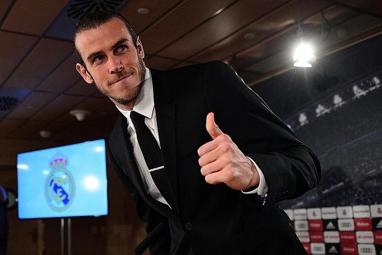 Real Madrid star Gareth Bale during Monday's press conference at the Bernabeu stadium to talk about his contract extension. The Welsh forward is reportedly now earning £350,000 (S$595,000) a week after tax following the signing of a contract extensi