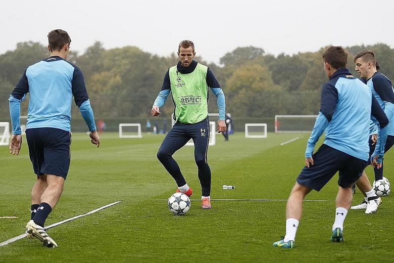 Tottenham's Harry Kane training with team-mates yesterday ahead of their Champions League clash with Leverkusen at Wembley. The Englishman's return cannot come soon enough for his side, who have struggled up front without him. In a tight group, they 