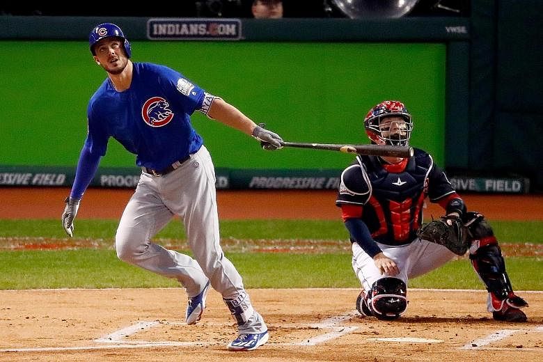 Cubs third baseman Kris Bryant hits a solo home run during the first inning to give Chicago a 1-0 lead in Game 6 of the World Series. The Cubs ended up 9-3 winners on Tuesday to set up Game 7.