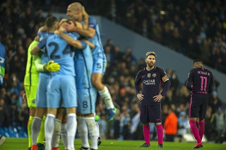 Barcelona star Lionel Messi (right) reacts to his side conceding a goal. The Argentinian put the visitors ahead but Manchester City hit back with three goals.