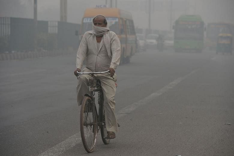 Smog and air pollution blurring the skyline in New Delhi yesterday. Coal-fired power generation contributes to the air pollution that makes India home to what the World Health Organisation has determined are 11 of the top 20 cities on the planet with the 