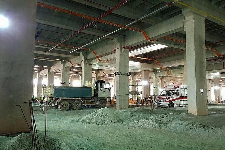 The two Bangladeshi nationals were run over by a reversing tipper truck at the Mandai construction site (left). There was another fatal incident at the same worksite in May, when a worker died after he was pinned under a metal beam that had fallen fr