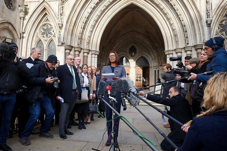 Ms Miller, a trust fund manager and member of pro-EU group People's Challenge, reading a statement outside the High Court in central London yesterday after winning the legal challenge that Article 50 cannot be triggered without a decision by Parliame