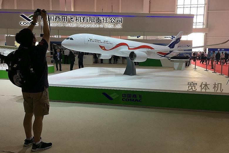A model of the planned jet on display at Airshow China in Zhuhai on Wednesday. It will compete directly with the Boeing 787 and the Airbus A-350.