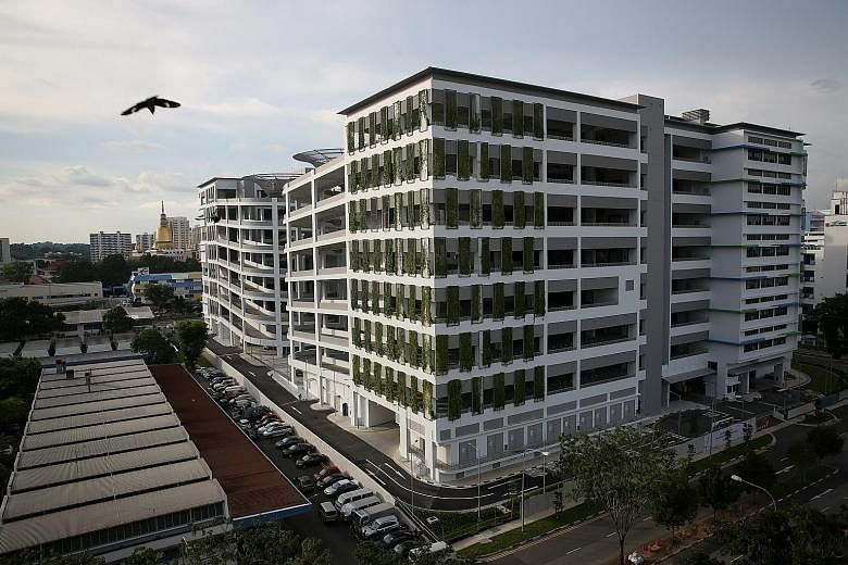 More than 150 tenants in the low-rise blocks 11 to 21, 27 and 34 in Sin Ming Industrial Estate (below) will begin relocating to the eight-storey Sin Ming AutoCity (above) from next January.