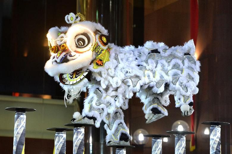 Lion heads used by lion dance troupes are still made by craftsmen. There is a need to look beyond conserving physical buildings and sites to focus on the conservation of social activities and practices associated with historical sites. 