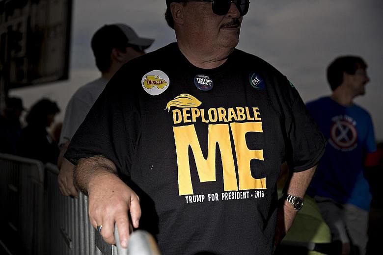 Left: Mr Trump speaking at a campaign rally in Selma, North Carolina, on Thursday. Below: A man in a "Deplorable Me" T-shirt ahead of Thursday's Trump rally in Selma - a reference to Mrs Clinton's depiction of some Trump supporters as a "basket of de