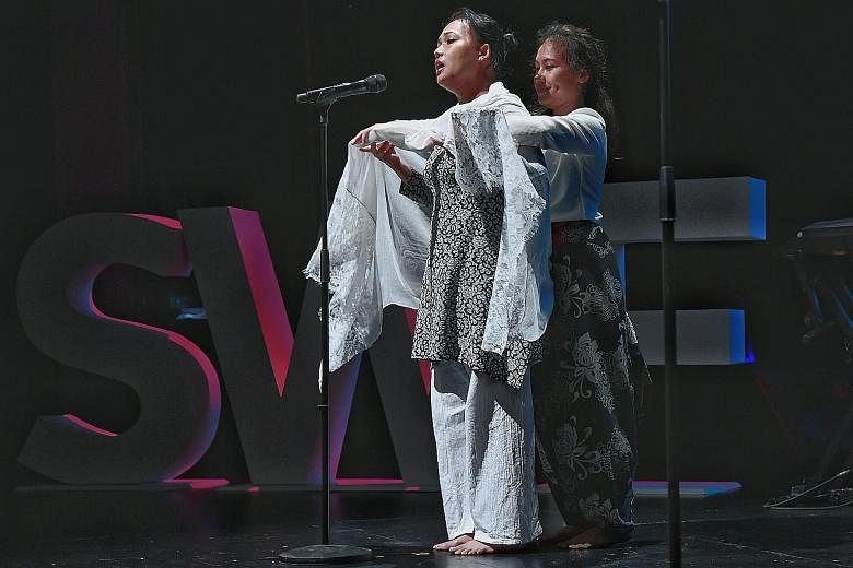 Author Noor Hasnah Adam and her daughter Nur Aisyah Lyana performing their commissioned piece, Genggaman Sayang (Love's Grasp) at the Singapore Writers Festival last night.
