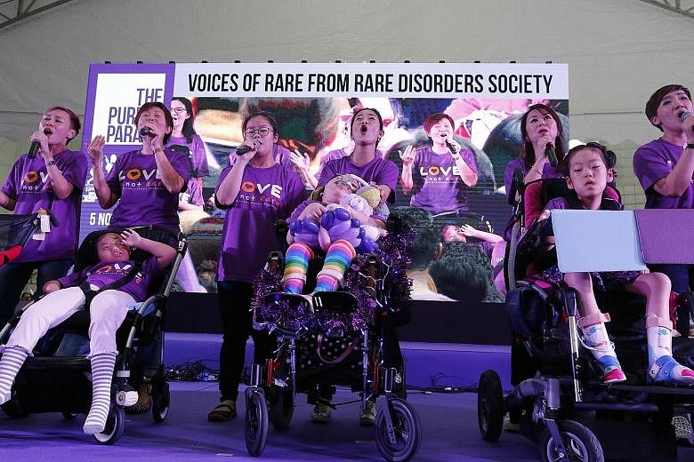 Members from the Rare Disorders Society showcasing their talent at the annual Purple Parade. Ms Phua, who is adviser to the Purple Parade committee, said she was heartened by the turnout for the event despite the rain yesterday. A model posing at Elg