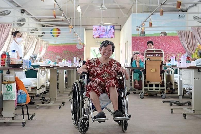 Madam Chew, who is paralysed on her right side, keeps herself busy by helping the nurses at Ren Ci nursing home.