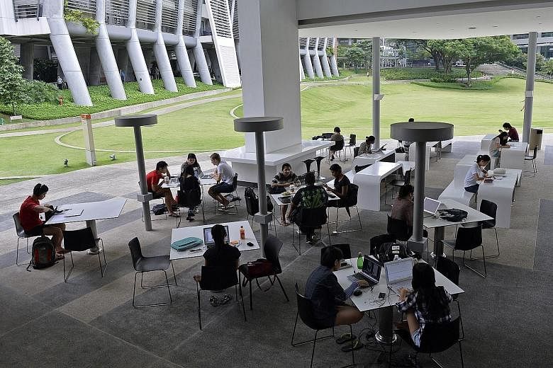 Students studying at the National University of Singapore University Town. With NUS expanding its residential college model, where students live and learn with professors, half of the freshmen can spend at least one year living and learning on campus
