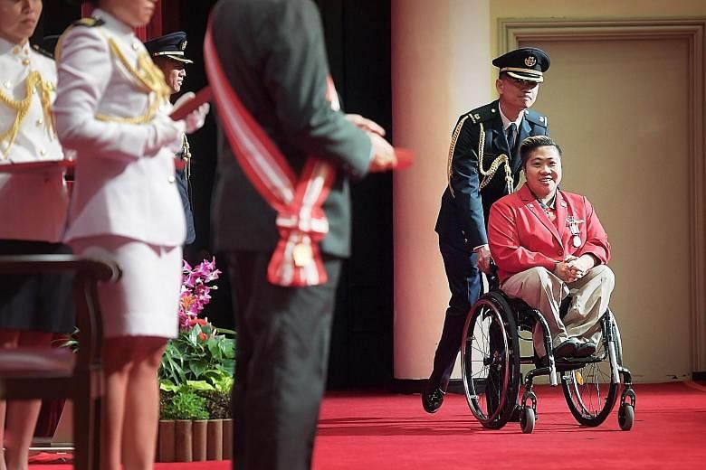 Left: Mr Peter Ho, former head of the civil service, receiving the Distinguished Service Order, one of Singapore's top national honours, from President Tony Tan Keng Yam yesterday, for his service to the country. Below: Para-swimmer Theresa Goh, who 
