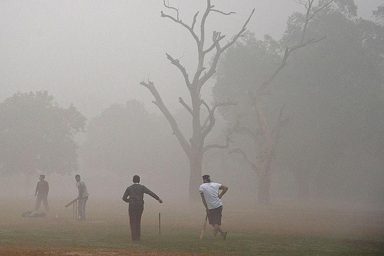 Life went on as usual yesterday in New Delhi, even as the city continued to struggle with one of the worst spells of air pollution in recent years. Young runners took part in the New Delhi 10K Challenge (above) amid the severe air pollution, while ad