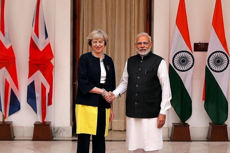British PM May meeting her Indian counterpart Narendra Modi at Hyderabad House in New Delhi yesterday.