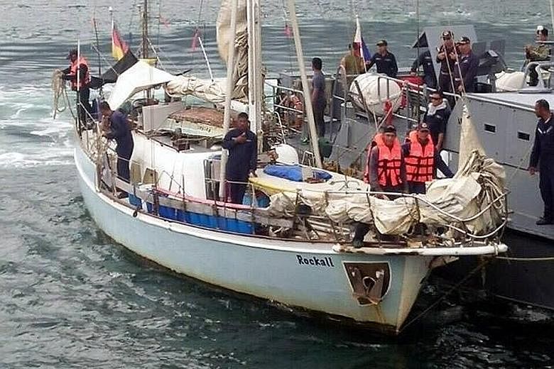 Filipino military personnel on the Rockall, which was found drifting on Sunday off Laparan island in Sulu province, the Abu Sayyaf stronghold. The extremist group abducted the yacht's German owner and killed his wife.