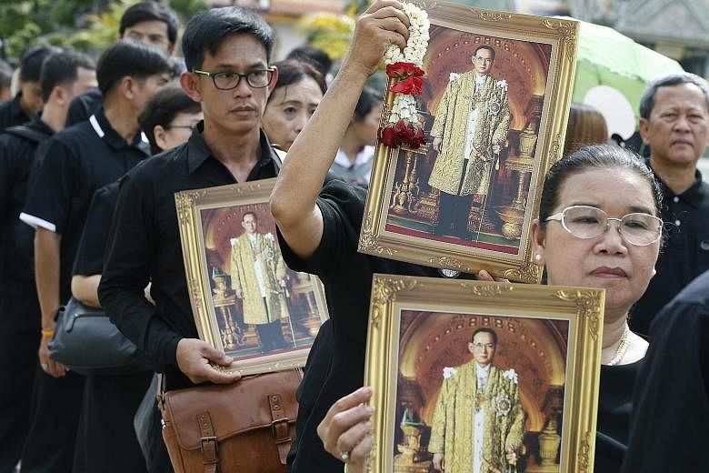Thai mourners lining up to pay obeisance to the Royal Urn of the late King Bhumipol in Bangkok on Oct 29.