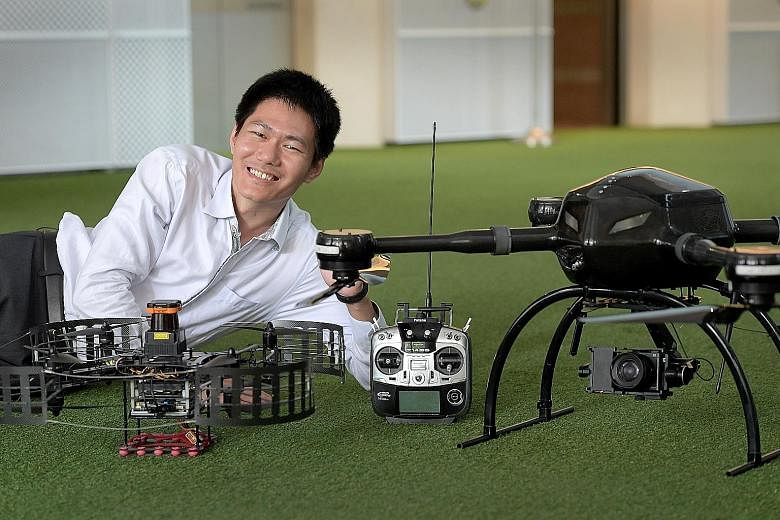 Dr Wang with his firm's BlackLion-068 (left) and BlackLion-168 (right) unmanned aerial vehicles.
