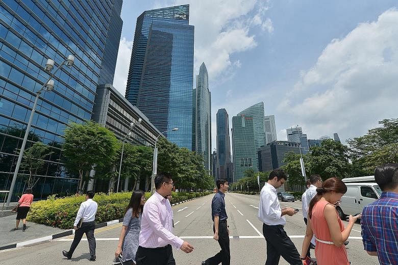 Singapore's central business district. Among the questions and points that MPs put to Manpower Minister Lim Swee Say yesterday was one suggesting that MOM work closely with unions and bosses to reduce the number of job mismatches. Mr Lim agreed, sayi