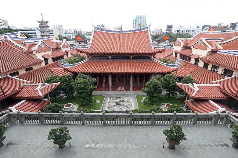 The tranquil and secluded Lian Shan Shuang Lin Monastery was completed in the 1900s and its Mahavira Hall and the Hall of Celestial Kings were gazetted as national monuments in 1980. Above: The monastery's Mahavira Hall. Left: An exhibition - to be h
