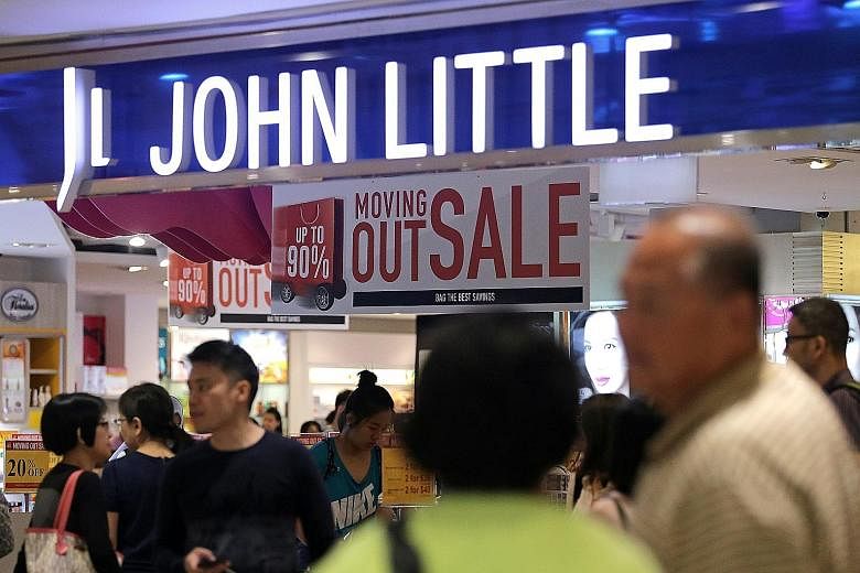 Shoppers checking out the closing sale at John Little's Plaza Singapura outlet on Monday. The department store will be revived next year as a pop-up concept.