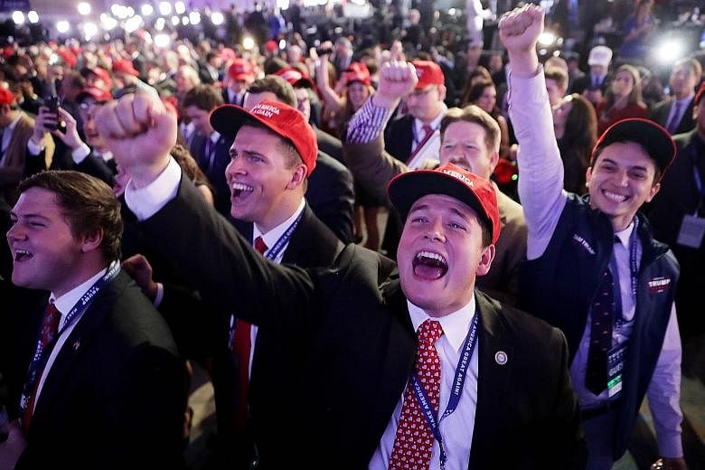 Supporters (above and below) of Republican presidential nominee Donald Trump cheering the results at an election night event at the New York Hilton Midtown.