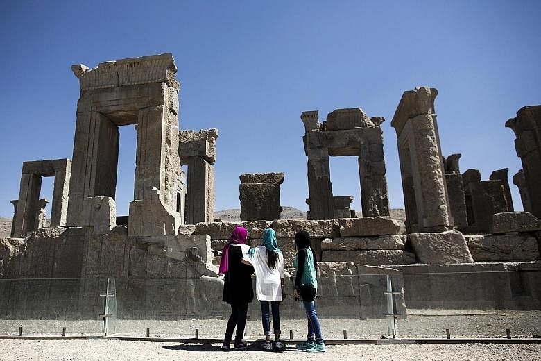 Iranians visiting the palace of King Darius in the ancient Persian city of Persepolis near Shiraz in southern Iran in September 2014. The Islamic republic is now a booming destination for Europeans seeking an adventurous vacation. Even tourism from t