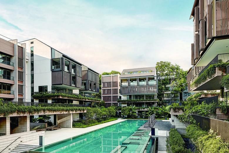 Interested viewers of residential project Cairnhill Nine (above). Sales at this and other residential developments including The Nassim (left) helped to boost CapitaLand's third-quarter profit to $247.5 million from $192.7 million a year earlier. Chi