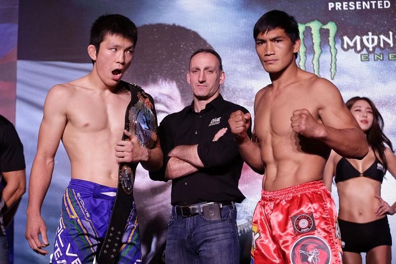 Japan's Shinya Aoki (left) will defend his One Championship mixed martial arts lightweight title against the Philippines' Eduard Folayang at the Singapore Indoor Stadium tomorrow evening. Their contest is one of two title bouts headlining One Champio