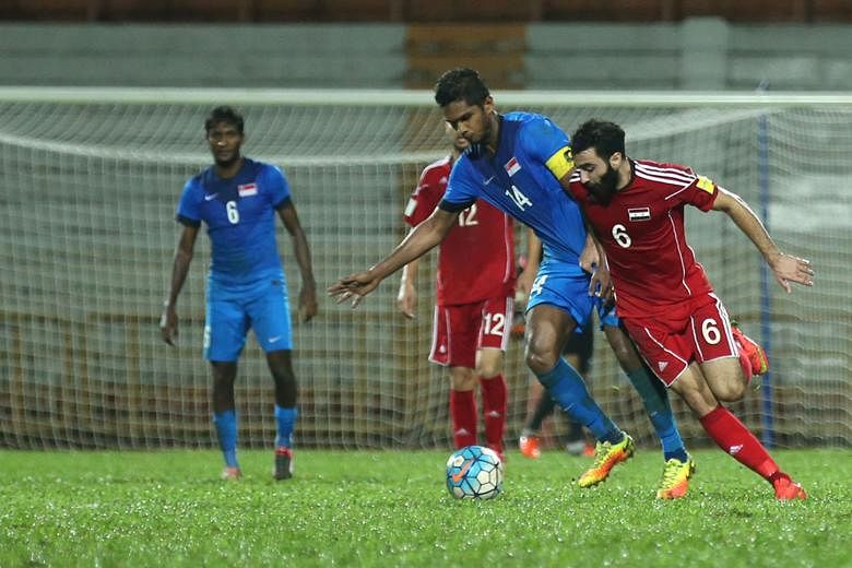 Singapore captain Hariss Harun being tackled by Syria's Amro Jeniat, who scored the first goal in the Middle East side's 2-0 win in Paroi. Hariss says his team need to cut out mistakes at the back. The Lions play Cambodia at Bishan Stadium on Sunday in th