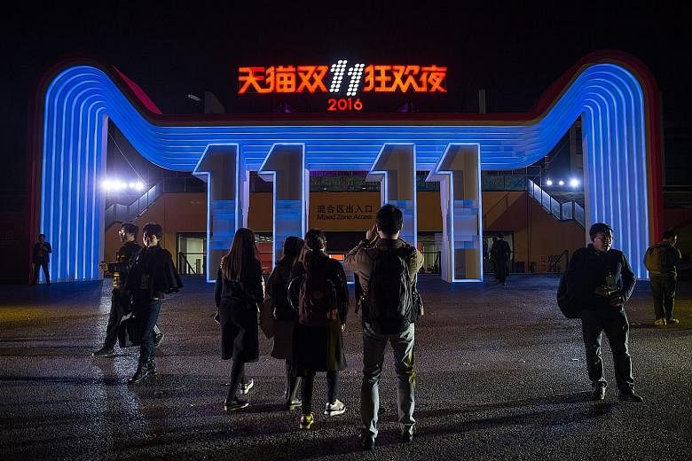 A light display for the Alibaba 11.11 Global Shopping Festival Countdown Gala outside the venue in Shenzhen yesterday. Alibaba organises a concert every year in the hours leading up to midnight, Nov 11.