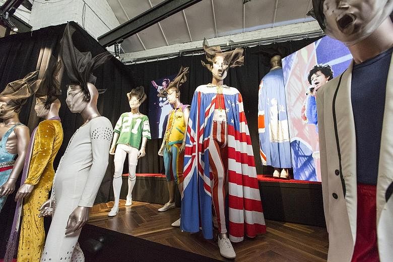 A colourful display of outfits worn by Mick Jagger over the years on display in Exhibitionism - The Rolling Stones.