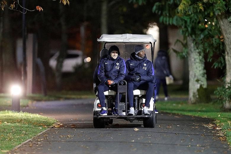 France players Antoine Griezmann and Paul Pogba on their way to training at Clairefontaine ahead of today's 2018 World Cup qualifier against Sweden. The teams are level at the top of Group A with seven points from three games.