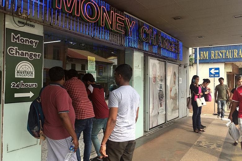 Money changers in Little India say more people have been approaching them to exchange the old 500 and 1,000 Indian rupees, which stopped being legal tender on Tuesday.