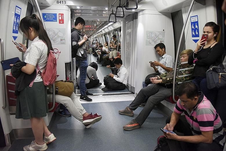 Passengers on a stationary train at Marymount station on Nov 2, when Circle Line services were disrupted. A train with faulty signalling hardware has been pinpointed as the cause of the glitch.
