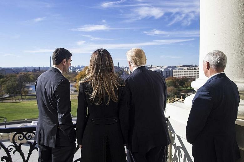 From left: House Speaker Paul Ryan, future First Lady Melania Trump, President-elect Donald Trump, and vice-president-elect Mike Pence on the Speaker's Balcony at the Capitol building in Washington on Thursday.