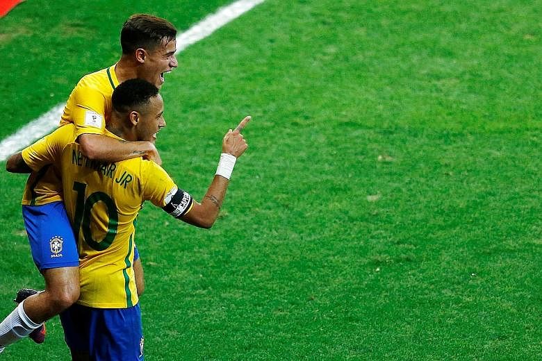 Neymar celebrating his goal in the 3-0 win over Argentina in World Cup qualifying with Philippe Coutinho. The Barca star has been hinting his club should buy his Brazil team-mate, as they are "made to play with each other".