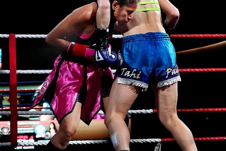 New Zealand's Gentiane Lupi (right) defeated home hope Nurshahidah Roslie via a technical knockout in the fifth round of their 10-round title bout. The Kiwi later praised the Singaporean because "she stood firm and was always aggressive and ready to 