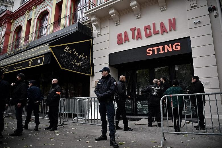 Security officers guarding the entrance of the Bataclan concert hall yesterday, hours before the reopening concert by Sting.