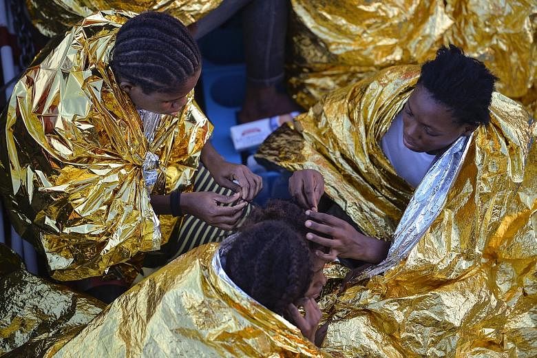 Migrant women from Africa on board a rescue ship after being found off the Libyan coast, among the hundreds who arrive in Europe every month.