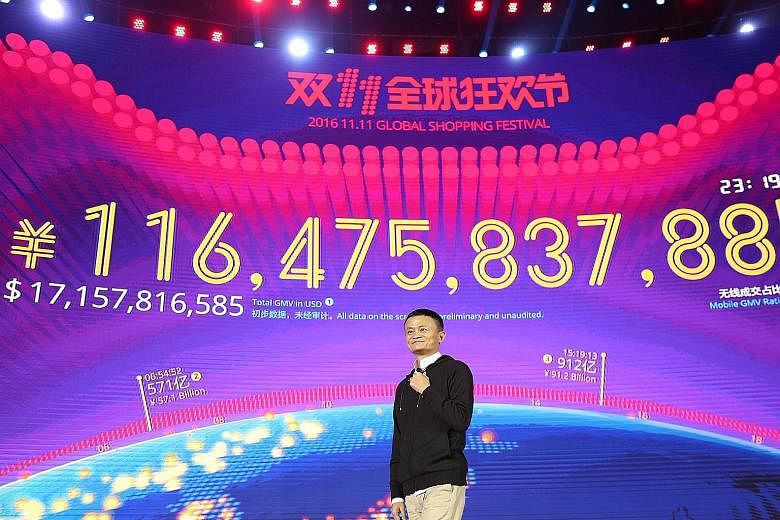 Mr Ma, founder of Alibaba, speaking in front of a screen displaying his company's sales figure during the Singles' Day festival in Shenzhen on Friday. Analysts say that although the day's turnover is only a fraction of the online retailer's total ann