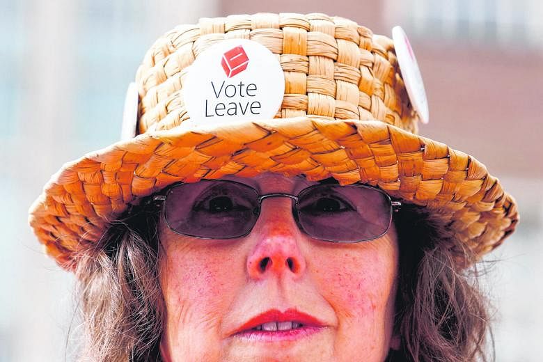 A "Leave" supporter wearing her vote on her hat in Exeter, Britain, in May. Europe has to tackle its problems of immigration and cultural identity, said Mr Tharman.